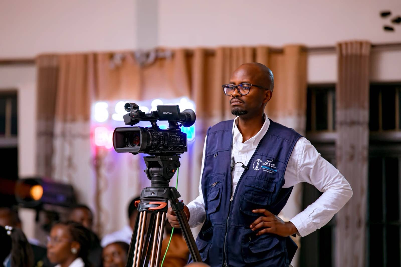 Camera operator filming a concert