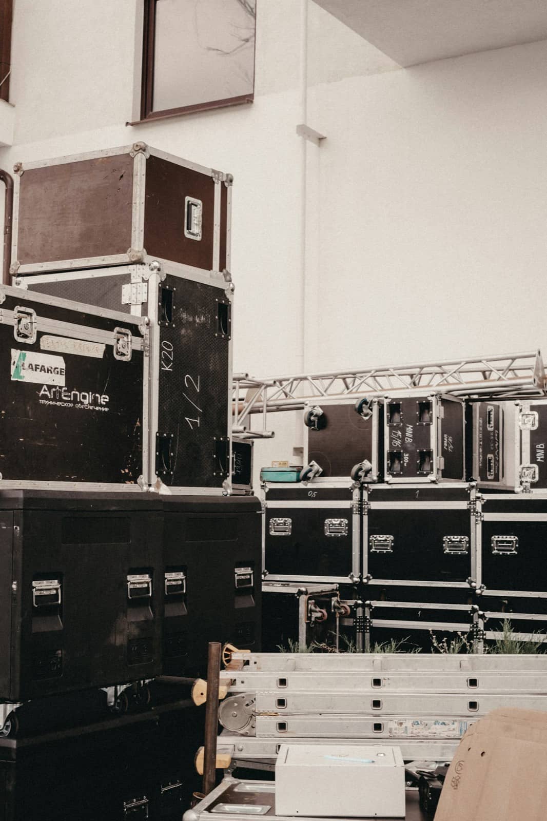 Production flight cases stacked backstage